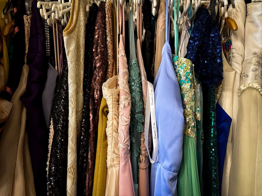 Elegant dresses hanging neatly in a well-lit custom closet space